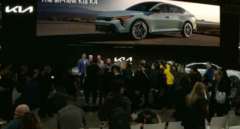 The all-new Kia K4 at the 2024 New York auto show (Karim Habib in grey suit on stage) The all-new Kia K4 on display at the 2024 New York Auto Show
