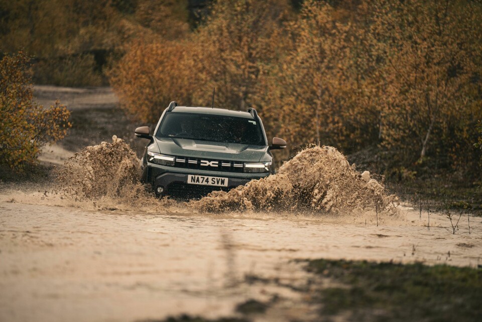 Have at it, puddle! The Duster 4x4 makes short work of its aquatic foe James in Dacia Duster