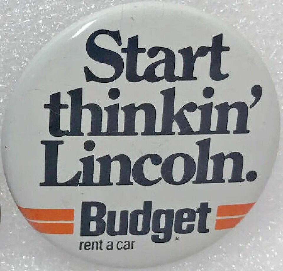 We know how car rental works; EVs change things Lincoln Rent a Car sign