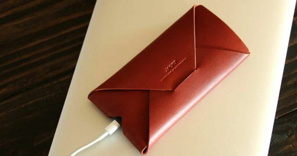 An iphone wallet designed by Flynn for his bespoke leather goods company JAQET Jaquet iPhone Wallet