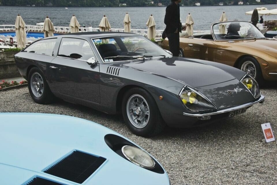 The angular lines of the 400GT Flying Star II, in contrast to curvaceous photobombing Miura Miura photobombs Flying Star II