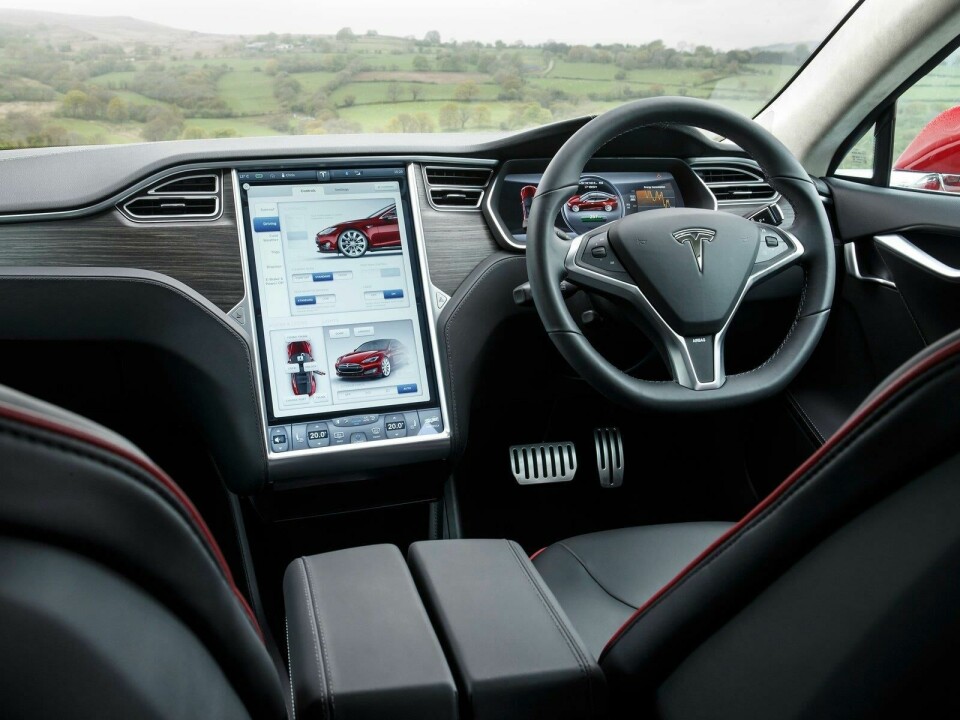 Horizontal, sculpted dash meets vertical, flat screen Tesla Model S dashboard