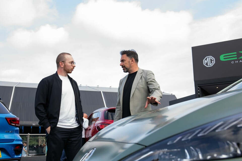Carl Gotham (right) at the MG stand; matching green blazer a total coincidence. CDN-Goodwood-9771