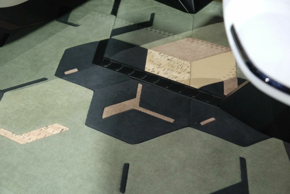 GAC Entranze - designed to share experiences GAC Entranze’s mixed-material honeycomb-motif carpeting