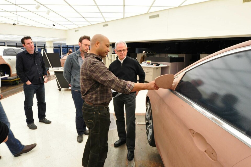 Gilles inspecting a clay model the-designers-ralph-gilles-02.JPG