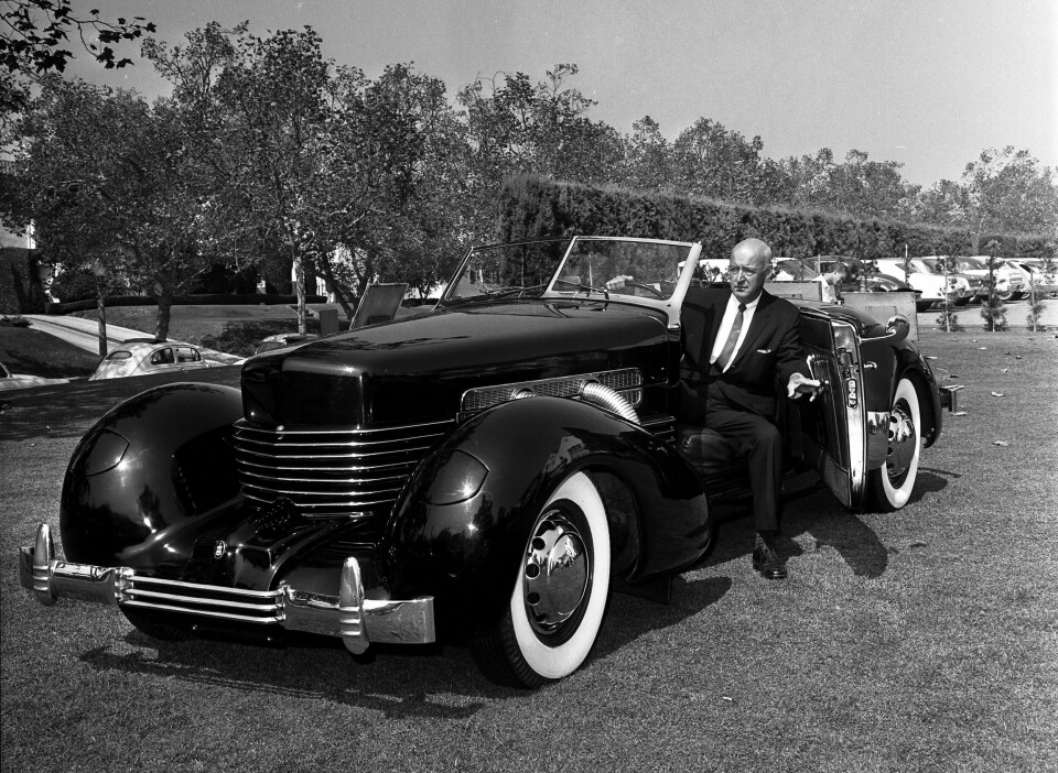 Cord designer Gordon Buehrig steps into his iconic creation, in a photo from the 1960s Gordon_Buehrig_with_original_Cord_Sportsman