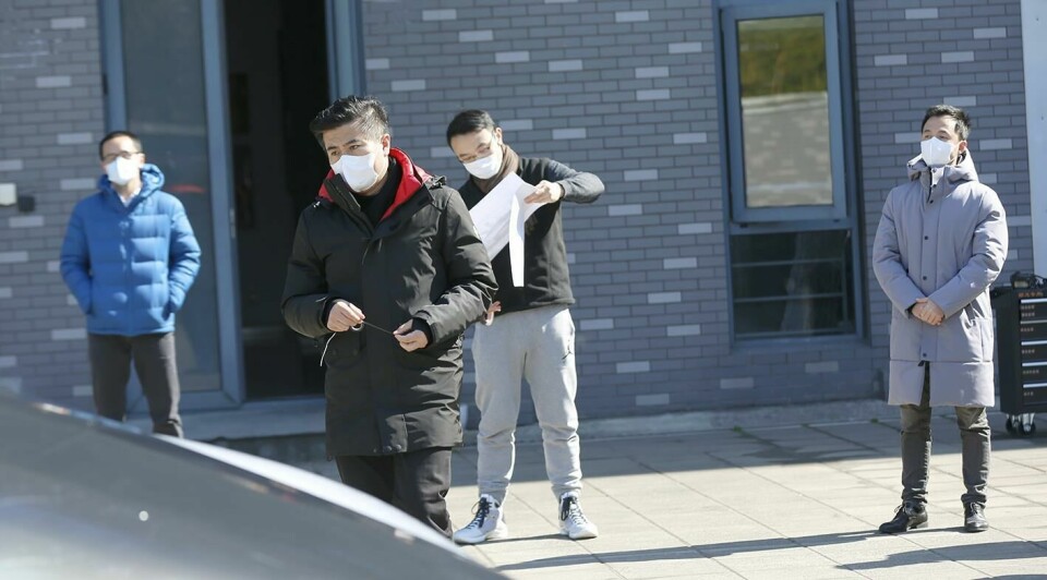 Shao Jingfeng assessing a model outside, observing social distancing rules SAIC return to work after lockdown