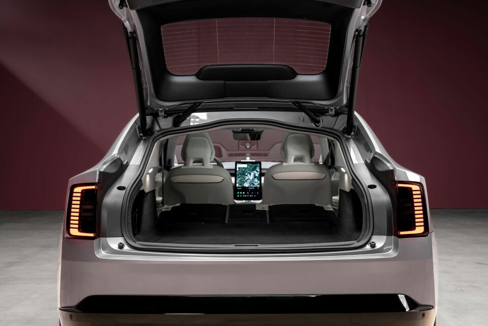 ES90 with large screen peeking through Volvo ES90 - ext rear-on (hatch open)