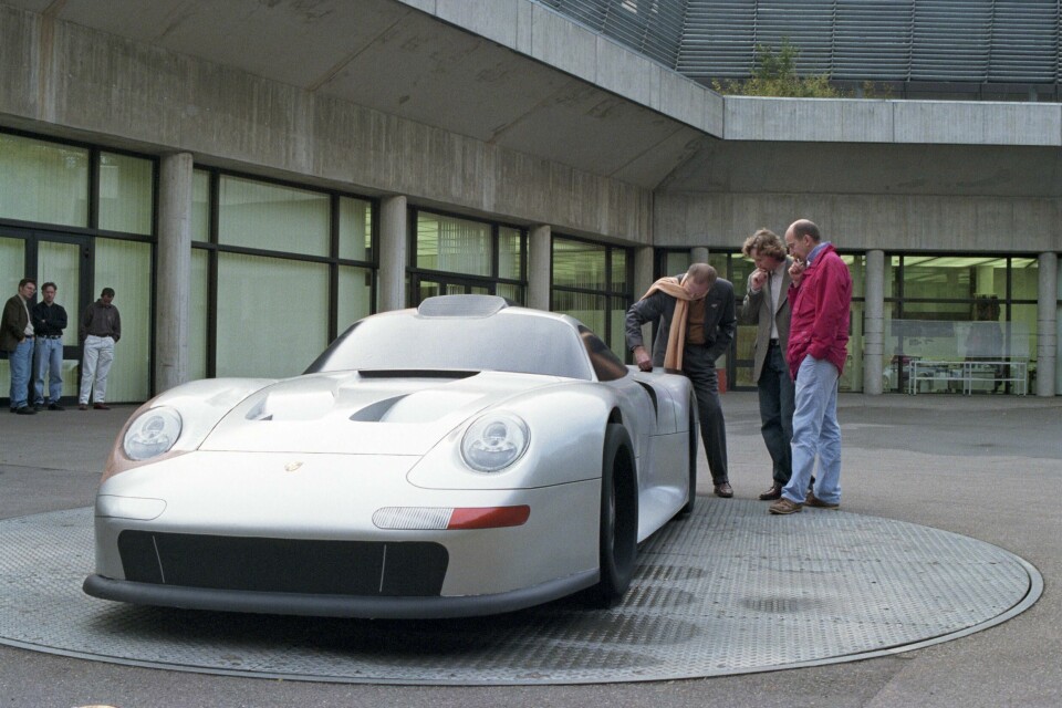 Tony Hatter (centre) inspects a model on the turntable Porsche young Tony Hatter 45314