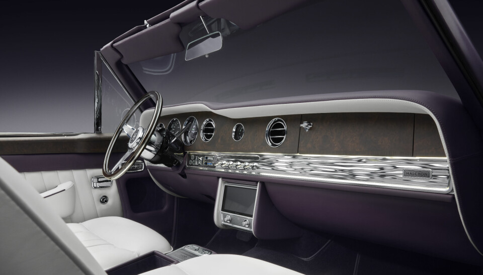Matte wood contrasts the wave-like detailing on the dashboard